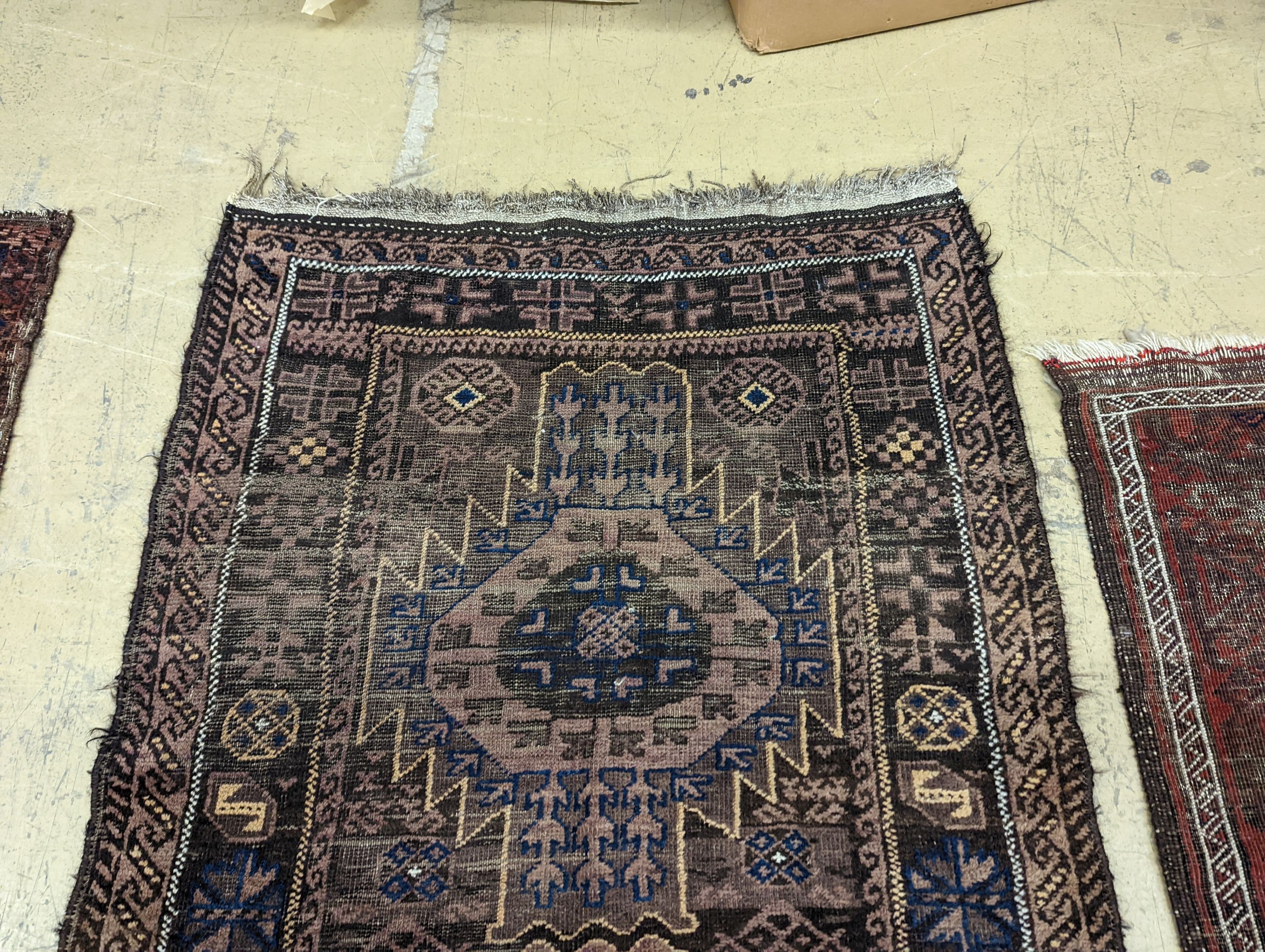 Two Caucasian geometric polychrome rugs, largest 190 x 96cm